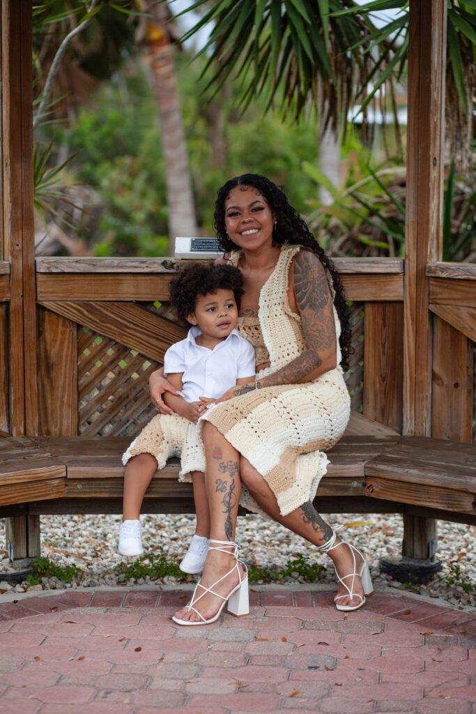 Mom and son seated and smiling for photo