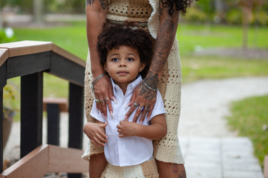 Close up of young boy in front of his mom