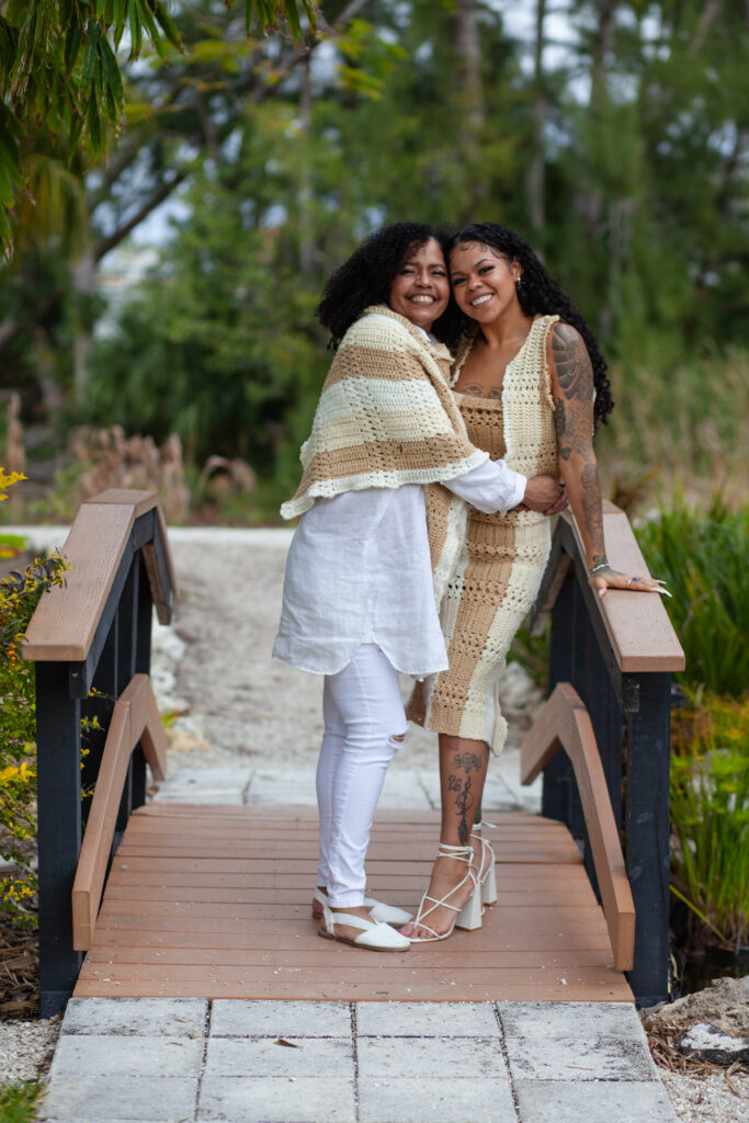 Mom hugs her adult daughter