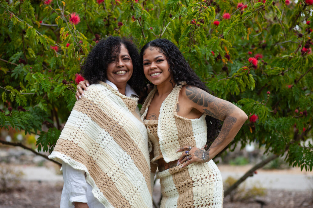 Mom and daughter smiling