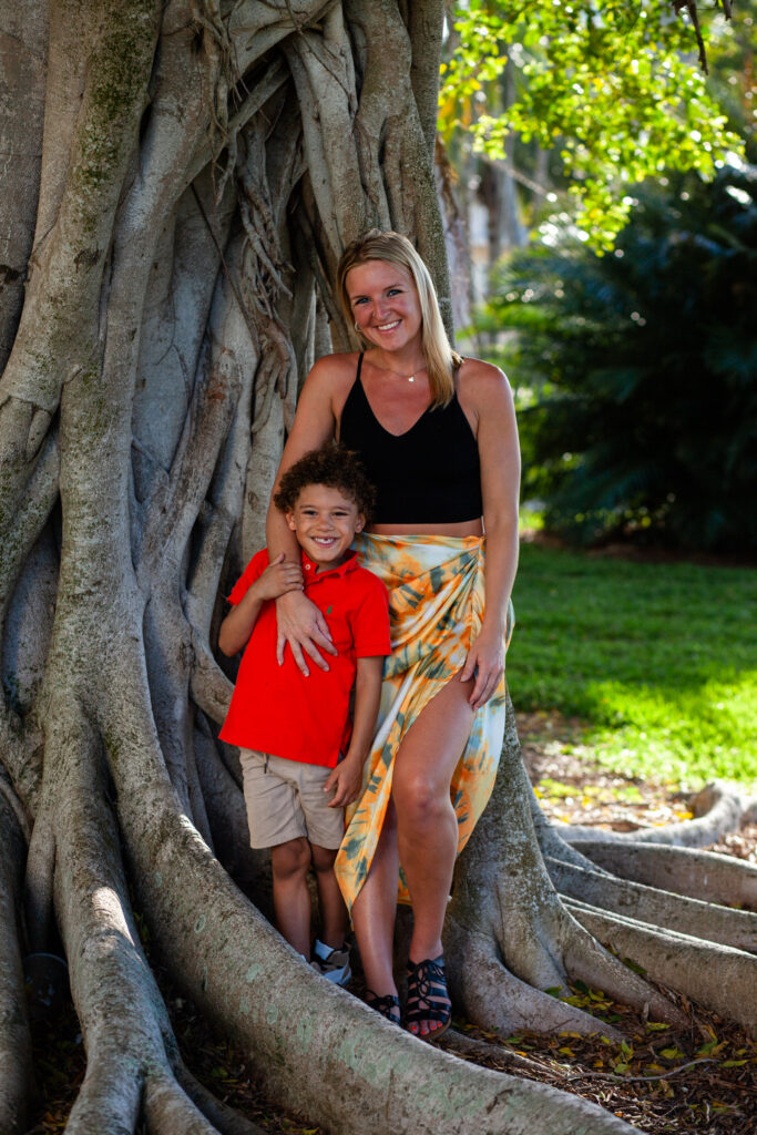 Woman and her young son smile for picture