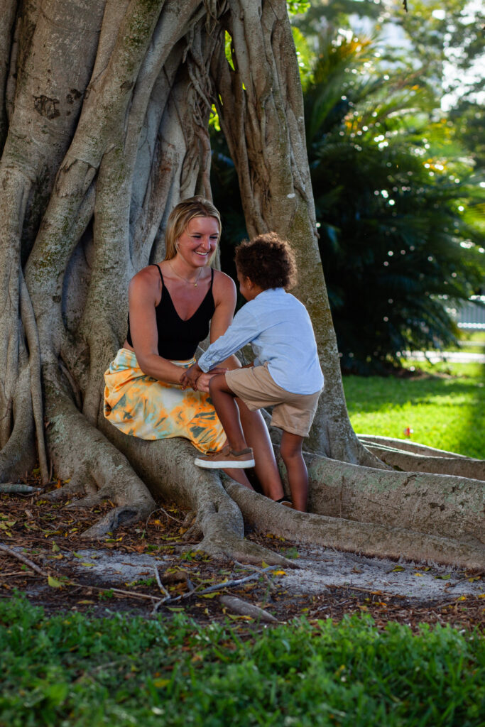 Woman playing with her young son