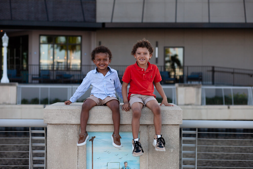 Two brothers smiling side by side