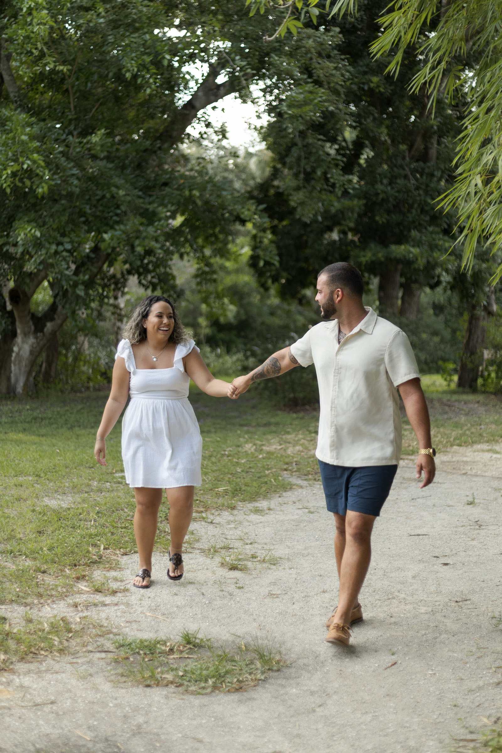 Couple laughing and walking towards the camera