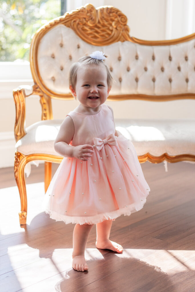 first birthday photo in pink dress