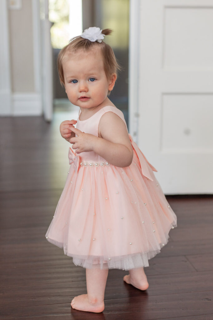 baby walks for first birthday photo