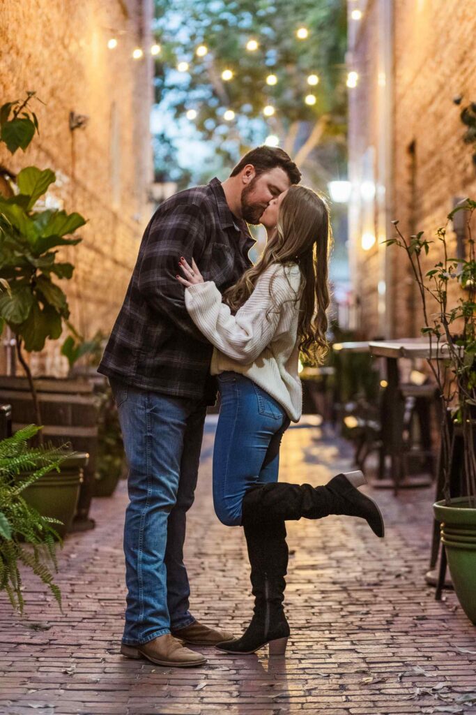 Couple kiss in an alleyway in Downtown Fort Myers