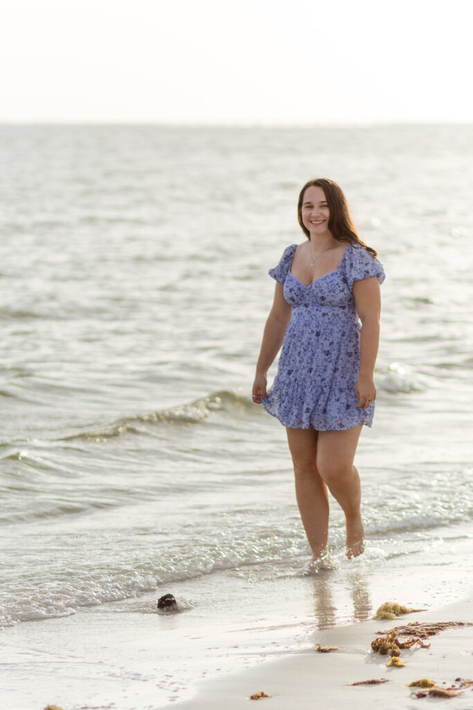 Woman walking in the shoreline