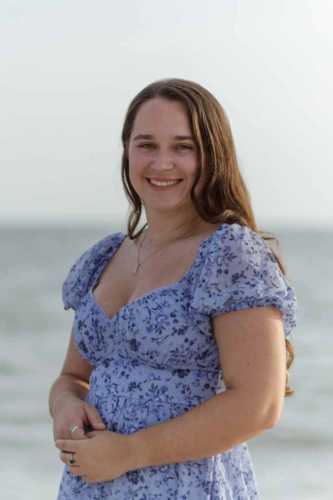 Woman smiling at the camera for her senior portraits