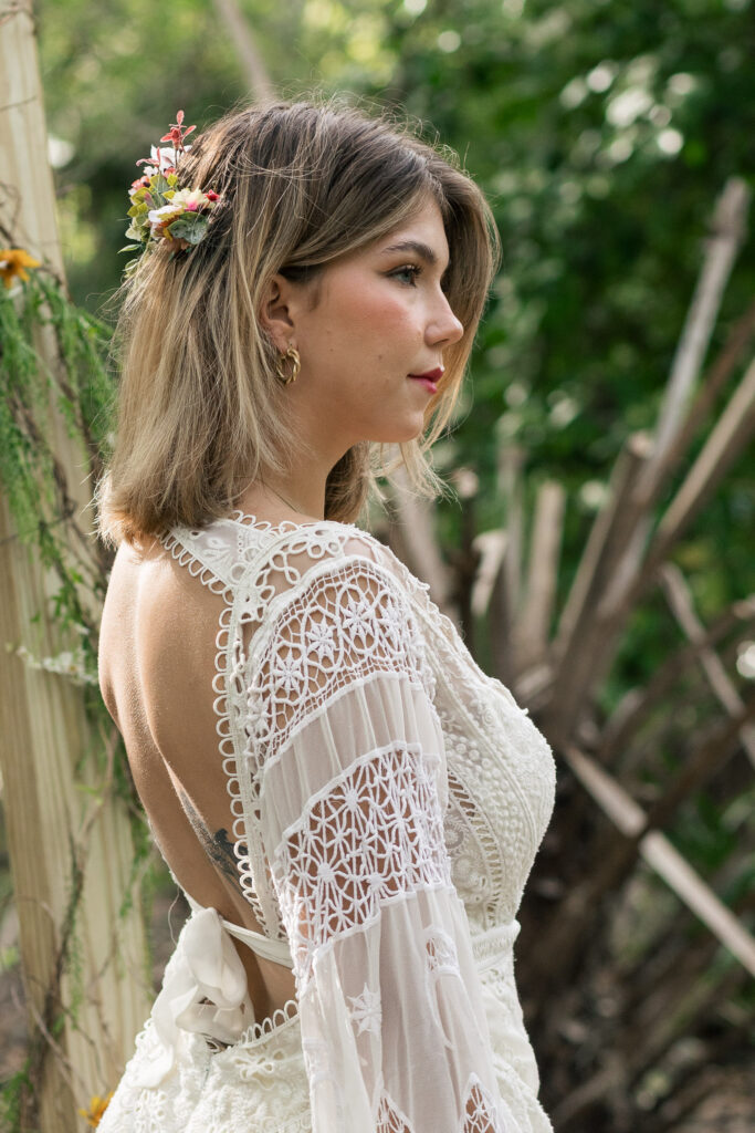 Back and side profile of bride as she looks seriously off camera