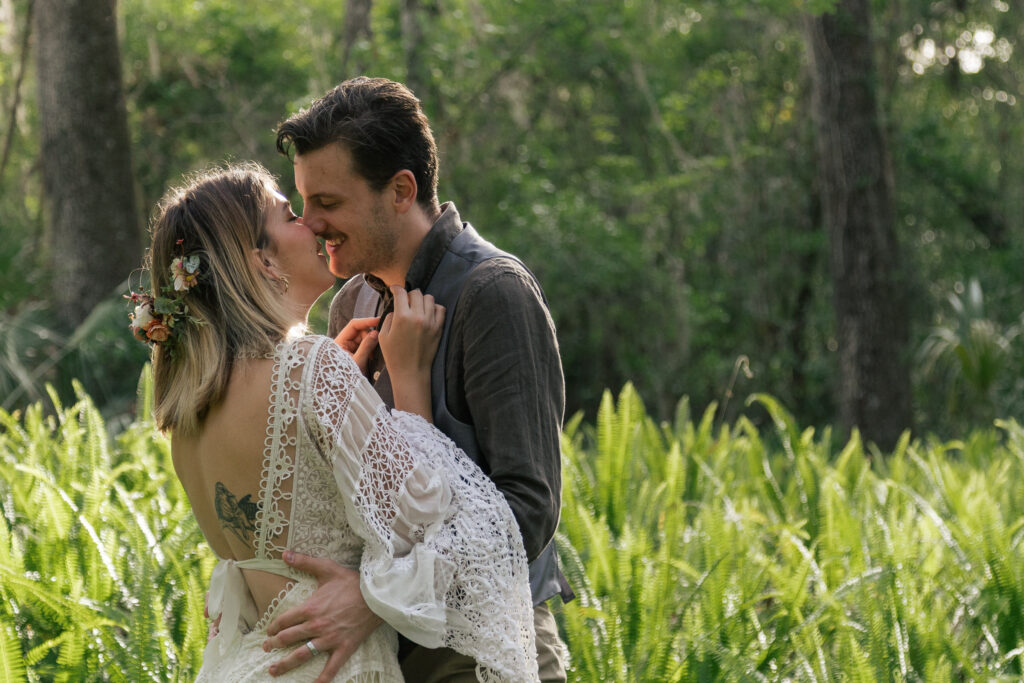 Couple laughs and goes in for a kiss