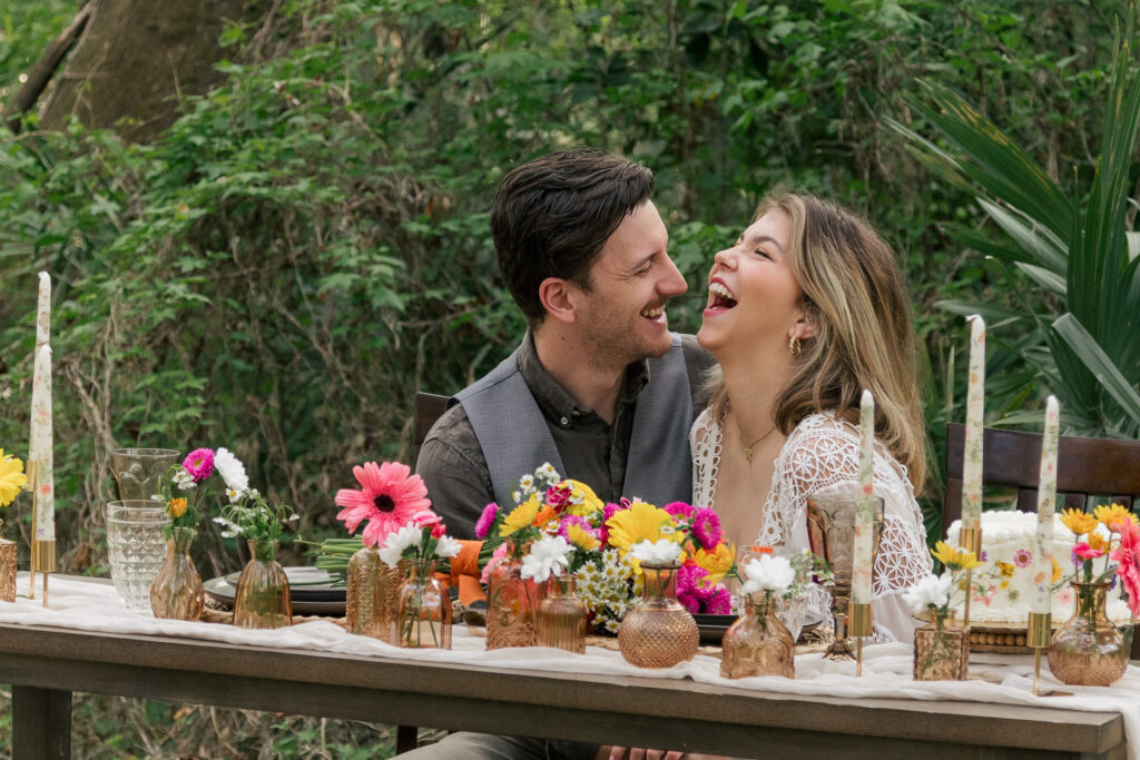 Couple smiling at their elopement table for two
