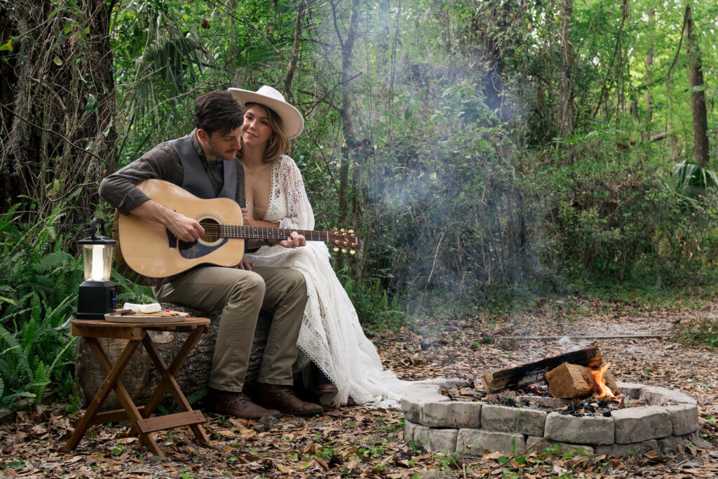 Groom plays guitar for his bride at their airbnb elopement