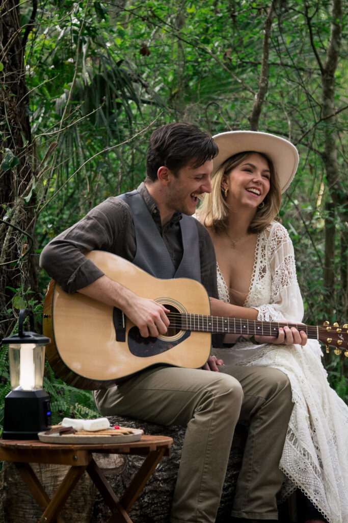 Groom plays guitar for his bride at their airbnb elopement