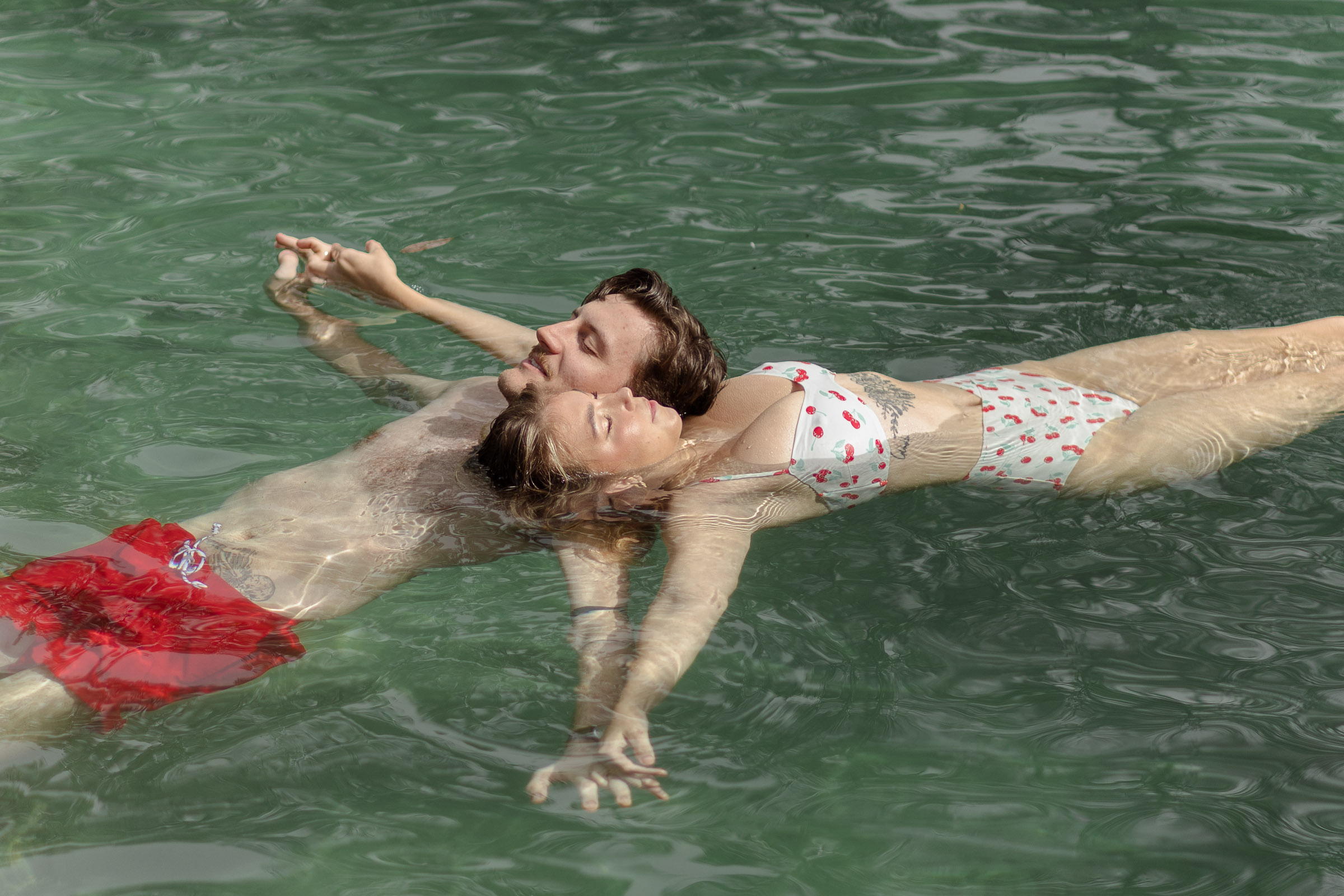 Couple floating together in Weeki Wachee River