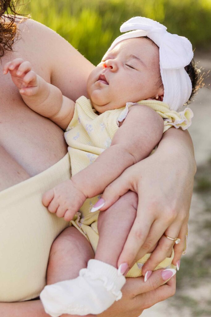 Infant baby in the arms of her mother