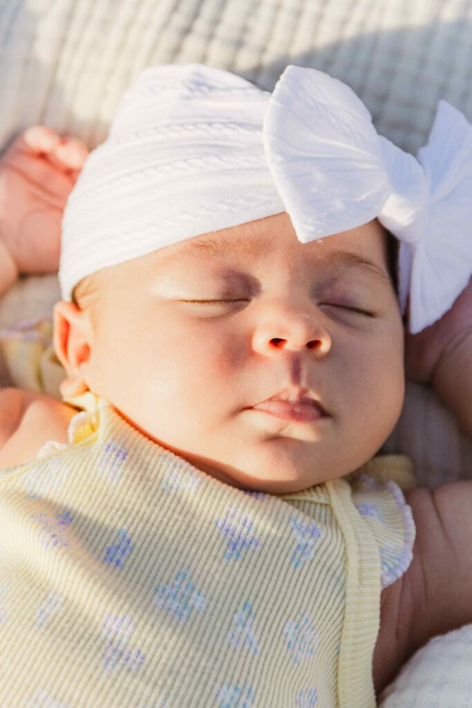Closeup of baby girl's face in golden hour light at a Lehigh Acres park
