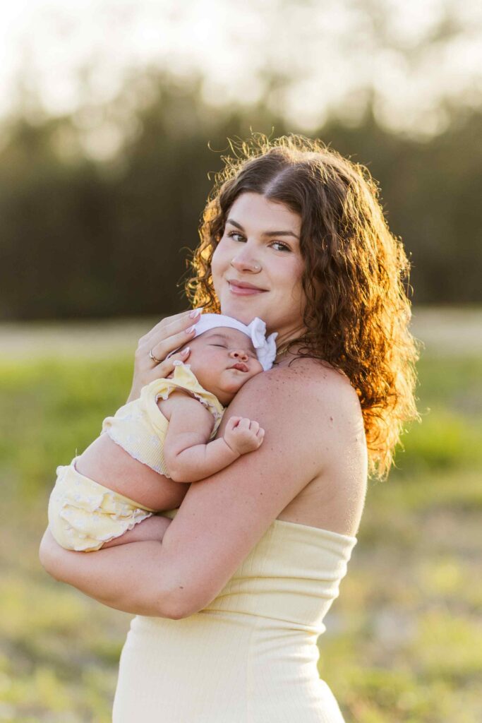 Mom hugging infant daughter