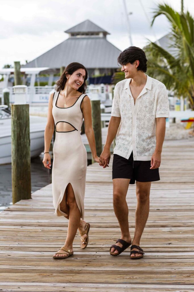 Couple walking on a boat dock