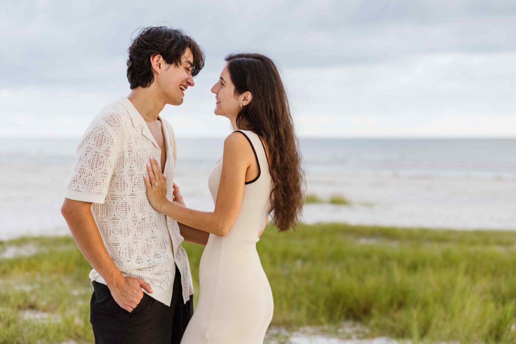 Couple playfully laughing on Fort Myers Beach
