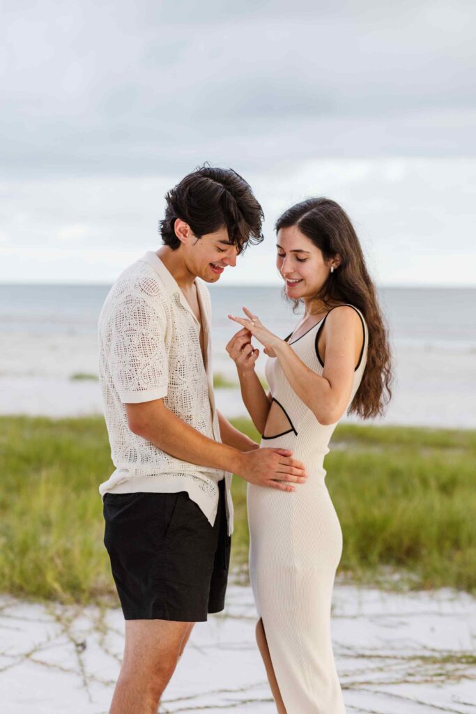 Woman admires her ring after proposal