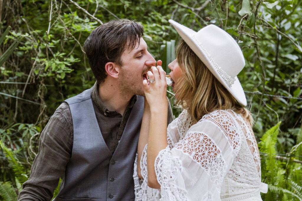 Bride and groom bite a smores together like Lady and the Tramp