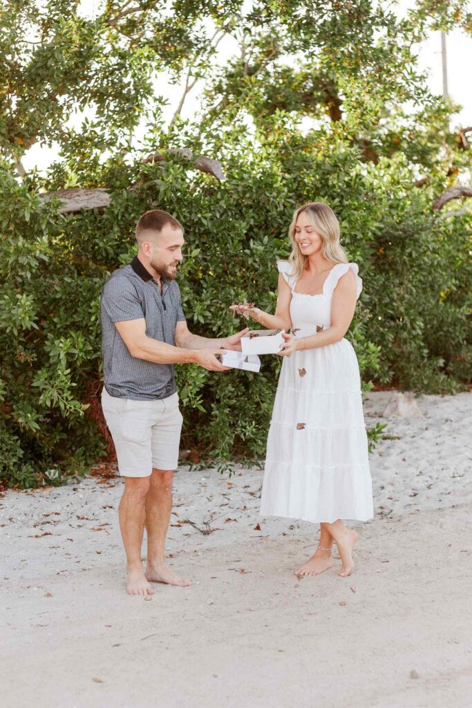 Couple releases butterflies from a box after their proposal