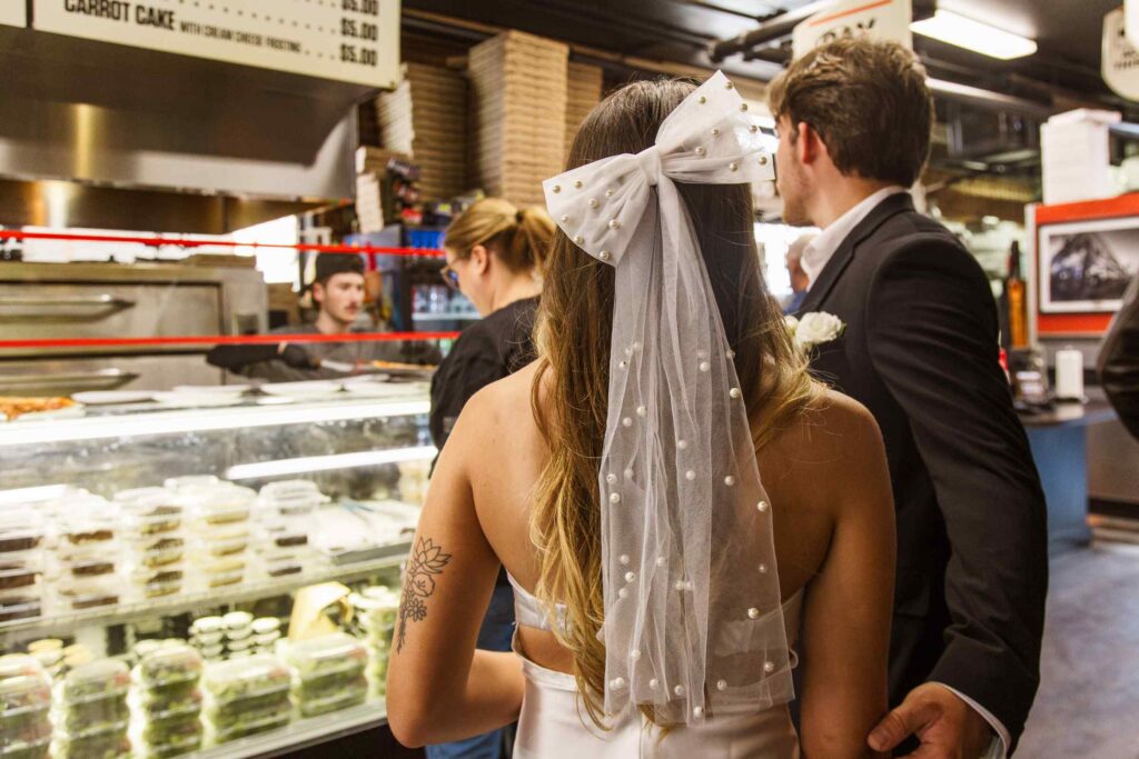 Bride and groom at Downtown House of Pizza counter
