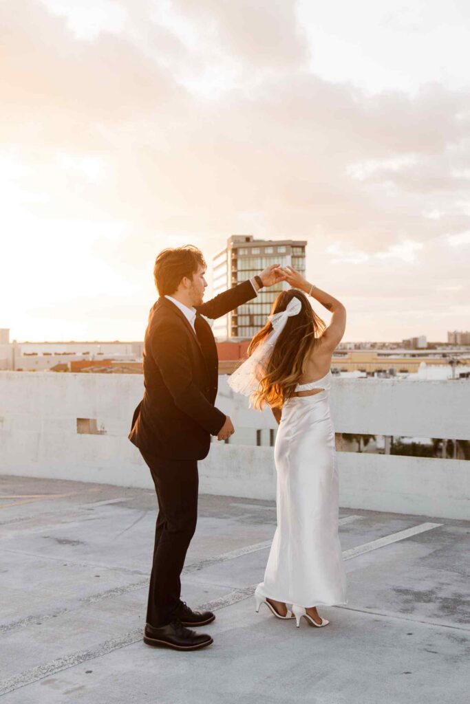 Bride and groom having a first dance on top of a parking garage in Downtown Fort Myers