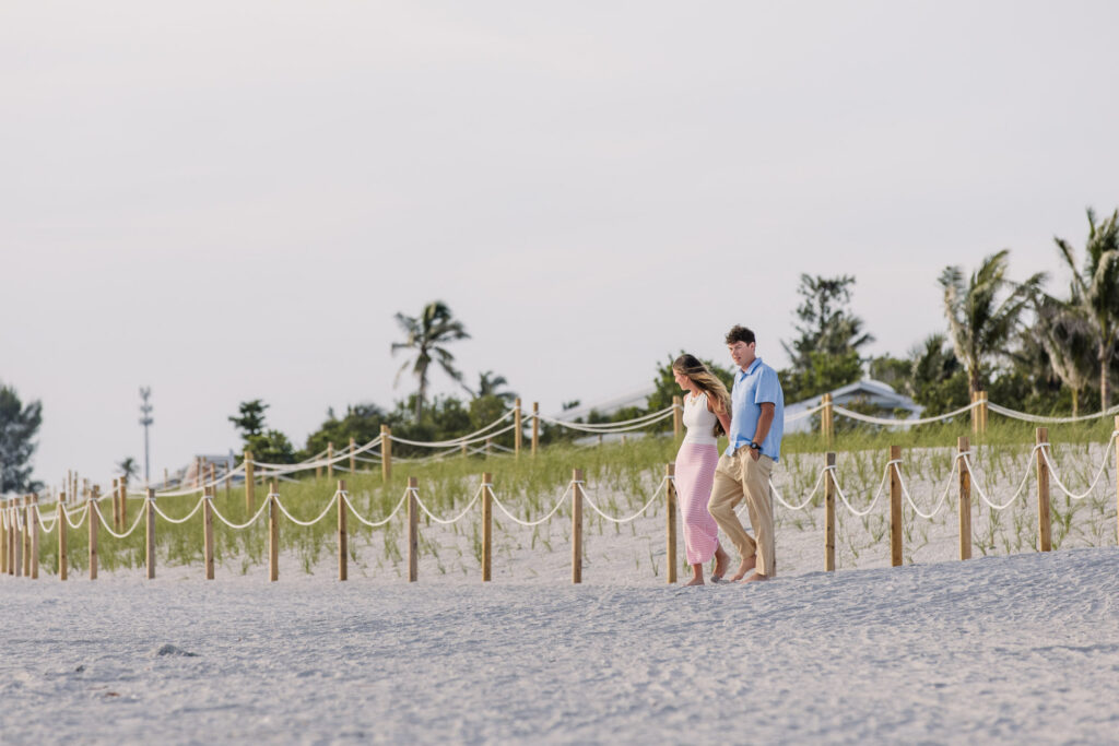 Couple walking onto Captiva Island beach