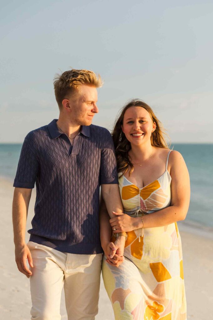 Woman walking holding her fiance's arm