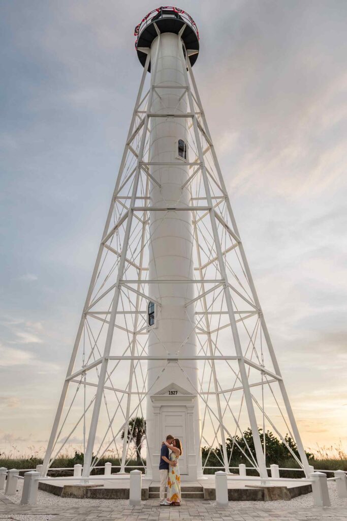 Couple posing at the bottom of the Gasparilla Lighthouse