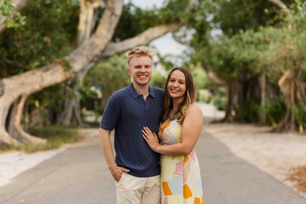 Couple poses for a photo on Banyan Street in Boca Grande