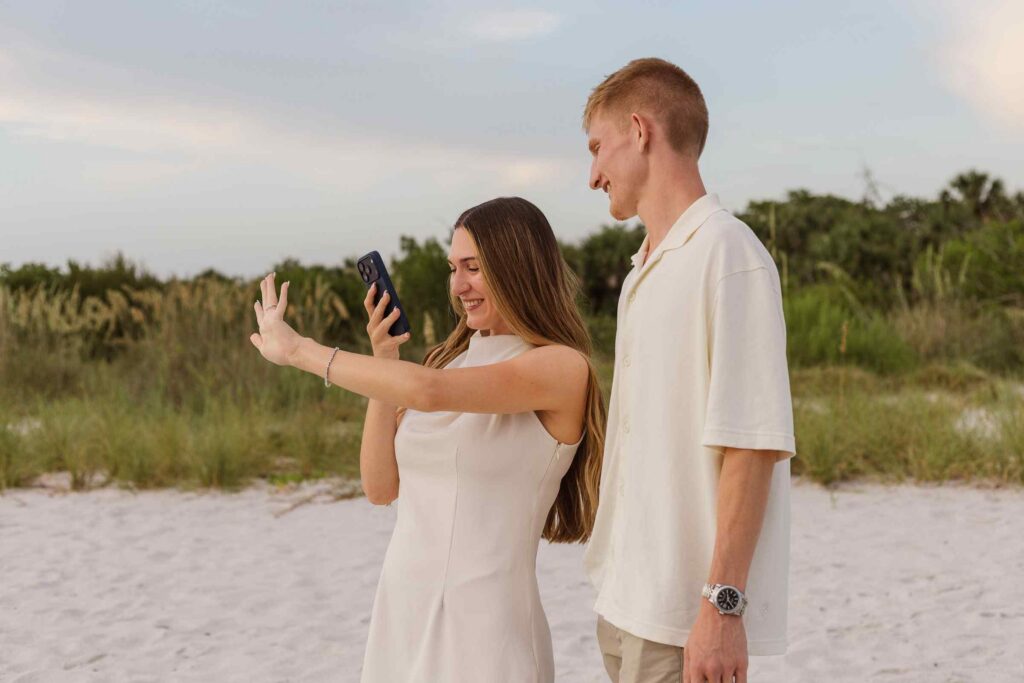 Woman facetimes family while showing off her engagement ring