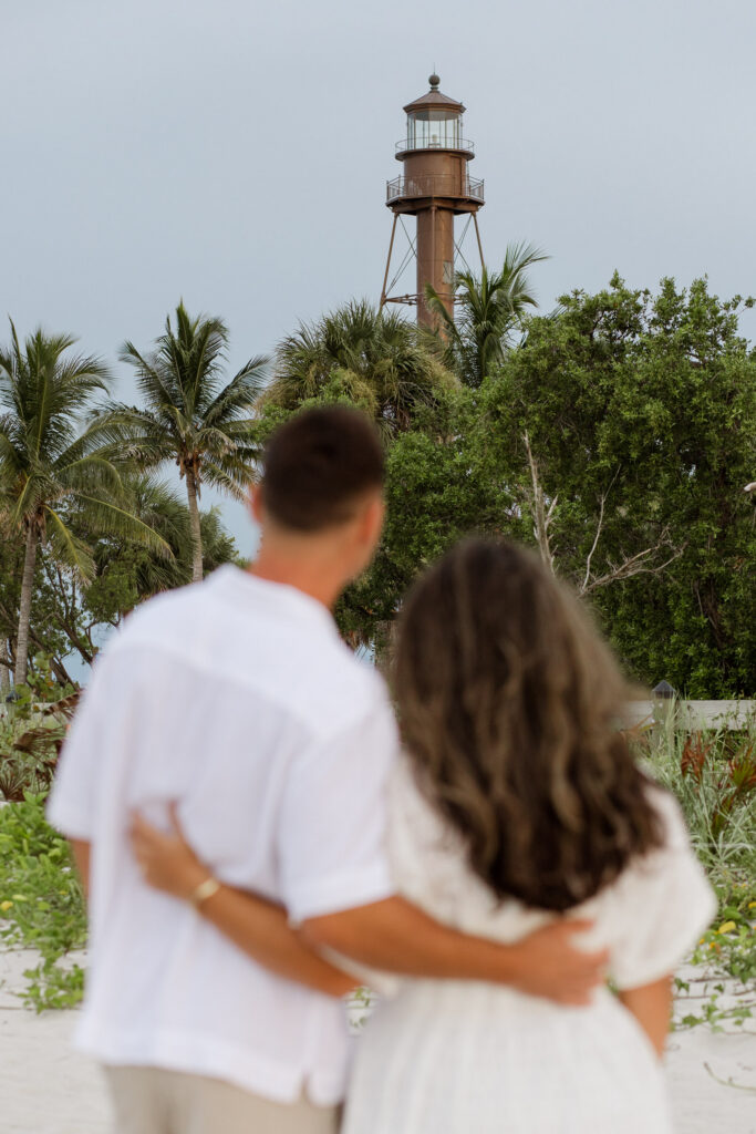 Couple looking at the Sanibel Lighthouse